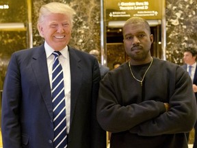 In this Dec. 13, 2016, file photo, President-elect Donald Trump and Kanye West pose for a picture in the lobby of Trump Tower in New York. (Seth Wenig/AP Photo/Files)