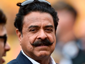 In this Sunday, Oct. 8, 2017 file photo, Jacksonville Jaguars owner Shahid Khan on the sidelines as the team warms up before of an NFL football game against the Pittsburgh Steelers, in Pittsburgh