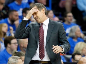 In this Oct. 19, 2017, file photo, New York Knicks head coach Jeff Hornacek reacts during a game against the Oklahoma City Thunder in Oklahoma City.