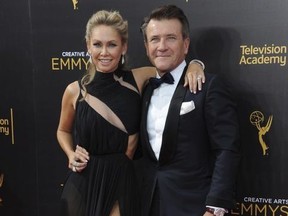 FILE - In this Sept. 11, 2016, file photo, Kym Johnson, left, and Robert Herjavec arrive at night two of the Creative Arts Emmy Awards at the Microsoft Theater in Los Angeles. Johnson and Herjavec welcomed twins into the world. Johnson posted on Instagram that their "little angels" were born on Monday, April 23, 2018.