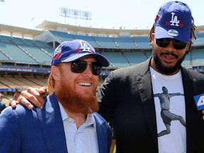 Los Angeles Dodgers third baseman Justin Turner, left, and pitcher Kenley Jansen comment on Dodger Stadium hosting the All-Star Game in 2020 at a news conference in Los Angeles Wednesday, April 11, 2018. (AP Photo/Damian Dovarganes)