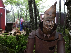 This June 5, 2015 photo shows the rusty Tin Man at the Land of Oz on Beech Mountain, N.C. The park announced that it will reopen for guided tours in June 2018.