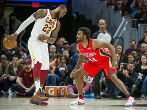 Cleveland Cavaliers' LeBron James watches New Orleans Pelicans' Solomon Hill during an NBA game on March 30, 2018