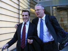 George McPhee and Tod Leiweke, right, leave the NHL's legal offices following the National Hockey League Board of Governors meeting on Dec. 5, 2012