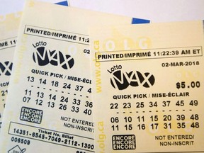 A lotto Max ticket is shown in Toronto on Monday Feb. 26, 2018.