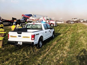 In this Sunday, April 29, 2018 photo provided by the Nebraska State Patrol, emergency personnel work at the scene of a multi-vehicle crash  caused by blowing dust from farm fields along Interstate 80 near York, Neb. (Sgt. Dean Riedel/Nebraska State Patrol via AP)