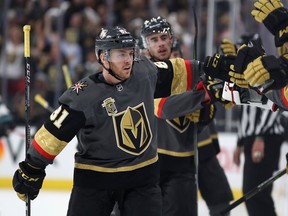 Jonathan Marchessault of the Vegas Golden Knights celebrates with teammates on the bench after scoring a goal against the San Jose Sharks during Game 1 at T-Mobile Arena on April 26, 2018