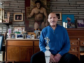 Bruno Sammartino sits in front of pictures, paitings and trophies highlighting his storied career as a wrestler and weightlifter, at his home in his North Hills, PA home, Wednesday, March 27, 2013.
