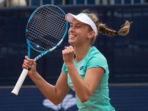 Elise Mertens from Belgium rejoices after winning against Aryna Sabalenka from Belarus  during the final match at the Samsung Open WTA tennis tournament in Lugano, Switzerland, on Sunday, April 15, 2018. (Ti-Press/Pablo Gianinazzi/KEYSTONE via AP)