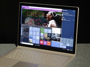 This June 28, 2016 file photo shows Windows 10 operating on a Microsoft Surface computer in New York. Technology companies whose devices and constantly-scrolling online services have driven us to distraction are beginning to acknowledge that their products can be a waste of time. Some of them now say they're trying to help. Microsoft is rolling out a free update to its Windows 10 computer operating system Monday, April 30, 2018,  that includes new features to keep people in a distraction-free zone.