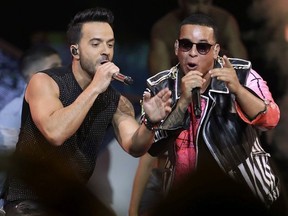 FILE - In this April 27, 2017, file photo, singers Luis Fonsi, left, and Daddy Yankee perform during the Latin Billboard Awards in Coral Gables, Fla. "Despacito" dominated 2017, but it's still bringing success to Luis Fonsi and Daddy Yankee: The artists are the leading nominees at the iHeartRadio Music Awards. IHeartMedia announced Wednesday, Jan. 10, 2018, that Fonsi and Yankee scored seven nominations each, including song of the year for the tune's version with Justin Bieber.