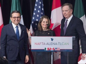 Foreign Affairs Minister Chrystia Freeland leaves the stage with United States Trade Representative Robert Lighthizer, right, and Mexico's Secretary of Economy Ildefonso Guajardo Villarrea after delivering statements to the media during the sixth round of negotiations for a new North American Free Trade Agreement in Montreal on Jan. 29, 2018. (Graham Hughes/THE CANADIAN PRESS)