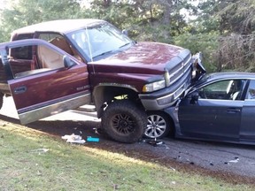 Two men from Nanaimo, B.C., are accused of using a Dodge pick-up truck as a weapon in a crash that destroyed two police vehicles and injured two officers. (Nanaimo RCMP)