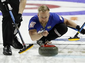 Sweden skip Niklas Edin delivers a stone against South Korea during the men's world curling championships Saturday, April 7, 2018, in Las Vegas. (AP Photo/John Locher)