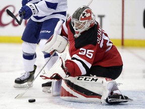 New Jersey Devils goaltender Cory Schneider blocks a shot from the Tampa Bay Lightning  during Game 3 Monday, April 16, 2018, in Newark, N.J.