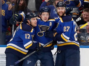 In this April 4, 2018, file photo, St. Louis Blues' Vladimir Tarasenko is congratulated by teammates Jaden Schwartz (17) and Alex Pietrangelo (27) after scoring against the Chicago Blackhawks, in St. Louis.