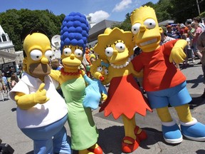 In this July 21, 2007, file photo, characters from The Simpsons pose before the premiere of "The Simpsons Movie," at the town's movie theater in Springfield, Vt.