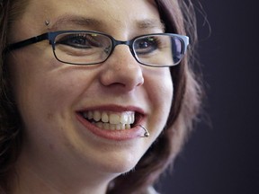 In this June 26, 2014, file photo, Michelle Knight smiles during an interview in Cleveland.