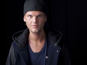 FILE - In this Aug. 30, 2013 file photo, Swedish DJ-producer, Avicii poses for a portrait in New York. Swedish-born Avicii, whose name is Tim Bergling, was found dead, Friday April 20, 2018, in Muscat, Oman. He was 28.