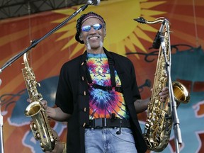 In a May 4, 2008 file photo, Charles Neville arrives with The Neville Brothers on stage to perform during the 2008 New Orleans Jazz & Heritage Festival in New Orleans. (Dave Martin/AP Photo/Files)