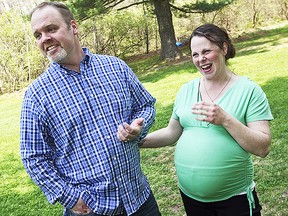 In this May 6, 2015 file photo, Kateri and Jay Schwandt stand outside their Rockford, Mich. home. (AP)