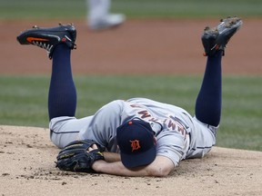 Detroit Tigers starting pitcher Jordan Zimmermann lays on the mound after getting hit by a ball Wednesday, April 11, 2018, in Cleveland.