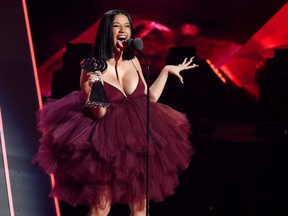In this March 11, 2018, file photo, Singer Cardi B accepts the Best New Artist award during the 2018 iHeartRadio Music Awards at The Forum in Inglewood, Calif.