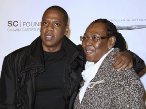In this Sept. 29, 2011 file photo released by Starpix, Shawn "Jay Z" Carter poses with his mother Gloria Carter at a fundraising event to support his college scholarship program in New York.