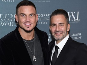 FILE - In this Nov. 1, 2017 file photo, Marc Jacobs, right, and Char Defrancesco attend the WSJ. Magazine Innovator Awards at The Museum of Modern Art in New York.  In a video posted on Instagram, Wednesday, April 4, 2018, Jacobs dropped to his knee at a fast-food restaurant in New York City to pop the question to DeFrancesco after a flash mob danced to Prince's "Kiss." In the caption, Jacobs calls DeFrancesco his "ride or die fiance."