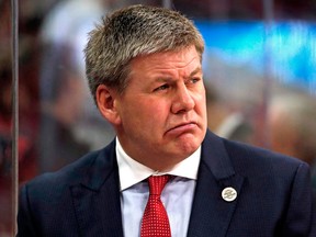 In this Feb. 10, 2018, file photo, Carolina Hurricanes head coach Bill Peters watches from the bench during the first period of an NHL hockey game against the Colorado Avalanche, in Raleigh, N.C.