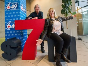 Christina Sevenoaks, with husband Tim, celebrating a $7-million win in last week's 6/49 at BCLC's headquarters in East Vancouver on Wednesday. (Arlen Redekop/Postmedia)