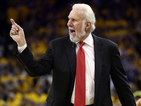 Coach Gregg Popovich of the San Antonio Spurs looks on during Game Two of the NBA Western Conference Finals against the Golden State Warriors at ORACLE Arena on May 16, 2017 in Oakland. (Photo by Ezra Shaw/Getty Images)