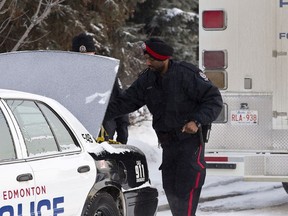 In this file photo, an Edmonton Police Service officer wearing a turban as part of his uniform works at a home in Edmonton, Alta., on Saturday, Dec. 21, 2013.