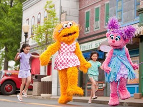 File photo of young visitors at Sesame Place near Philadelphia participate in a Neighourhood Street Party Parade with Zoe, left, and Abby Cadabby. (SESAME PLACE HANDOUT FILE PHOTO)