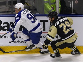 Tom Kostopoulos of the Wilkes-Barre/Scranton Penguins works against Nikita Soshnikov of the Toronto Marlies during an AHL game at the Ricoh Coliseum in February 2016.