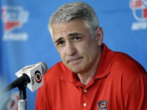 In this May 5, 2014, file photo, Carolina Hurricanes general manager Ron Francis takes questions from the media during a news conference in Raleigh, N.C. (AP Photo/Gerry Broome, File)