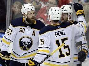 Buffalo Sabres' Sam Reinhart (23) celebrates with Ryan O'Reilly (90) and Jack Eichel 915) after scoring against the Florida Panthers, Saturday, April 7, 2018, in Sunrise, Fla. (AP Photo/Lynne Sladky)