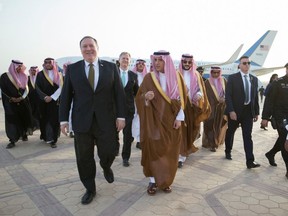 In this April 28, 2018 photo released by Saudi Press Agency, SPA, and made available April 29, 2018, U.S. Secretary of State Mike Pompeo, centre left, is received by Saudi Foreign Minister Adel Al Jubeir, in Riyadh, Saudi Arabia.