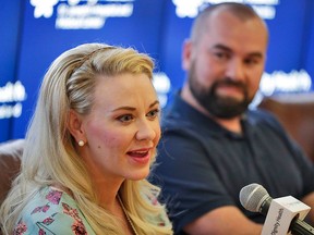 Jamie Scott speaks accompanied by her husband, Skyler, during a news conference at St. Joseph's Hospital and Medical Center in Phoenix on Friday, April 6, 2018. Jamie gave birth to quintuplets on March 21, 2018. (AP Photo/Matt York)