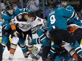 San Jose Sharks defenceman Dylan DeMelo, left, goes after Anaheim Ducks left winger Nick Ritchie as players fight during Game 3 on April 16, 2018