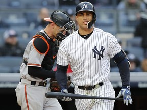 New York Yankees outfielder Giancarlo Stanton reacts after he stuck out during the 12th inning of a game in New York, Sunday, April 8, 2018. (AP Photo/Kathy Willens)