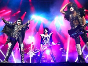 KISS (L-R) Gene Simmons, Tommy Thayer and Paul Stanley perform in Calgary, Alta. on Friday November 8, 2013 at the Scotiabank Saddledome.