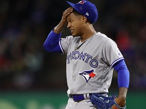 Marcus Stroman of the Toronto Blue Jays reacts after giving up a two run double against Joey Gallo #13 of the Texas Rangers in the fifth inning at Globe Life Park in Arlington on April 7, 2018 in Arlington, Texas. (Ronald Martinez/Getty Images)