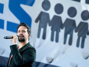 FILE - In this March 24, 2018 file photo, Lin-Manuel Miranda performs "Found Tonight" during the "March for Our Lives" rally in support of gun control in Washington.  Miranda thought he had a migraine. But the Broadway star says it's really shingles.  Miranda tweeted on Thursday, April 6, the diagnosis was caught early, but he's been quarantined from his 8-week-old son.