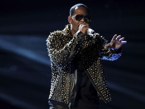 FILE - In this June 30, 2013, file photo, R. Kelly performs onstage at the BET Awards at the Nokia Theatre in Los Angeles. The Time's Up campaign is taking aim at R. Kelly over numerous allegations he has sexually abused women. The organization devoted to helping women in the aftermath of sexual abuse issued a statement on Monday, April 30, 2018, urging further investigation into Kelly's behavior.