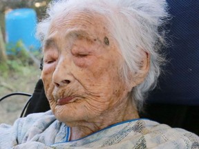 This Sept. 2015 photo shows Nabi Tajima, the world's oldest person, a 117-year-old Japanese woman. Tajima died of old age, at 117, in a hospital Saturday evening, April 21, 2018, in the town of Kikai in southern Japan, town official Susumu Yoshiyuki confirmed. She had been hospitalized since January.  (Kikai Town/Kyodo News via AP)