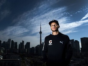 Canadian track and field star Andre De Grasse poses for a photograph after Athletics Canada held a press conference regarding the launch of the Toronto 2018 Track and Field in the 6ix in Toronto on Thursday, October 19, 2017.