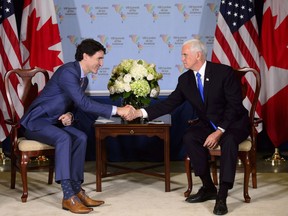 Prime Minister Justin Trudeau, left, meets with United States Vice President Mike Pence at the Summit of the Americas in Lima, Peru on Saturday, April 14, 2018. THE CANADIAN PRESS/Sean Kilpatrick