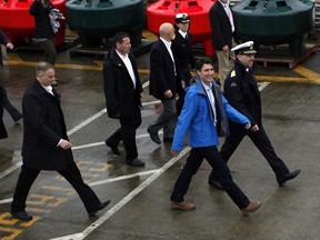 Prime Minister Justin Trudeau arrives to meet with Canadian Coast Guard members aboard the Sir Wilfrid Laurier to discuss marine safety and spill prevention, in Victoria on Thursday, April 5, 2018.
