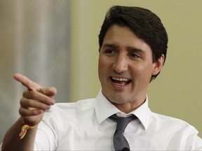 Prime Minister Justin Trudeau moderates a panel discussion as part of the Gender Equality and WomenÄôs Empowerment Summit in Ottawa on Thursday, April 26, 2018. (THE CANADIAN PRESS/ Patrick Doyle)